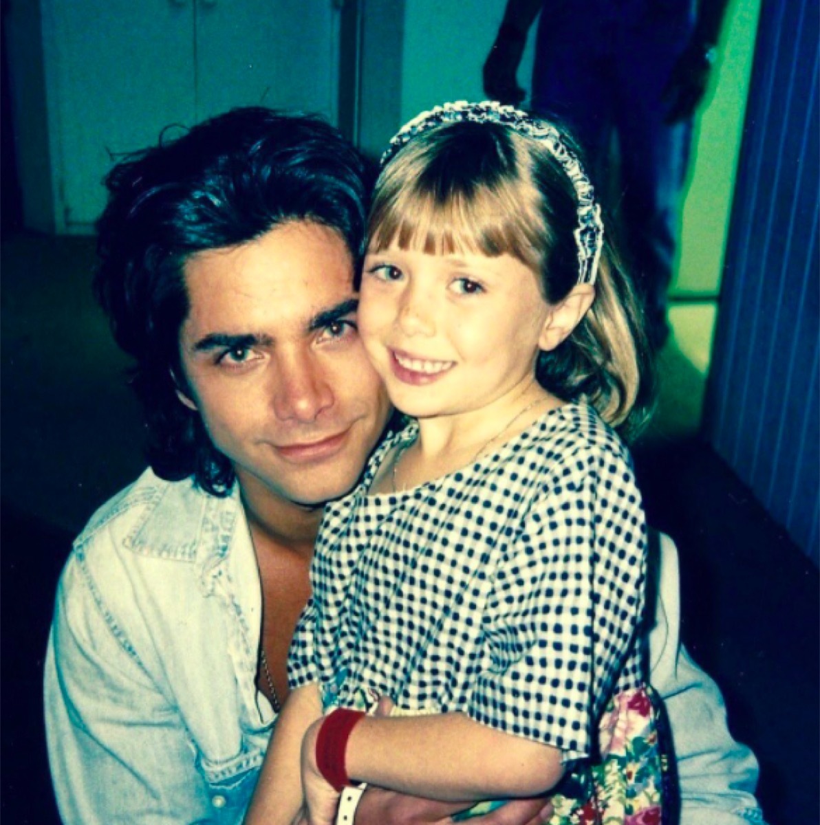 John Stamos and Elizabeth Olsen in an old photo posted to his Instagram