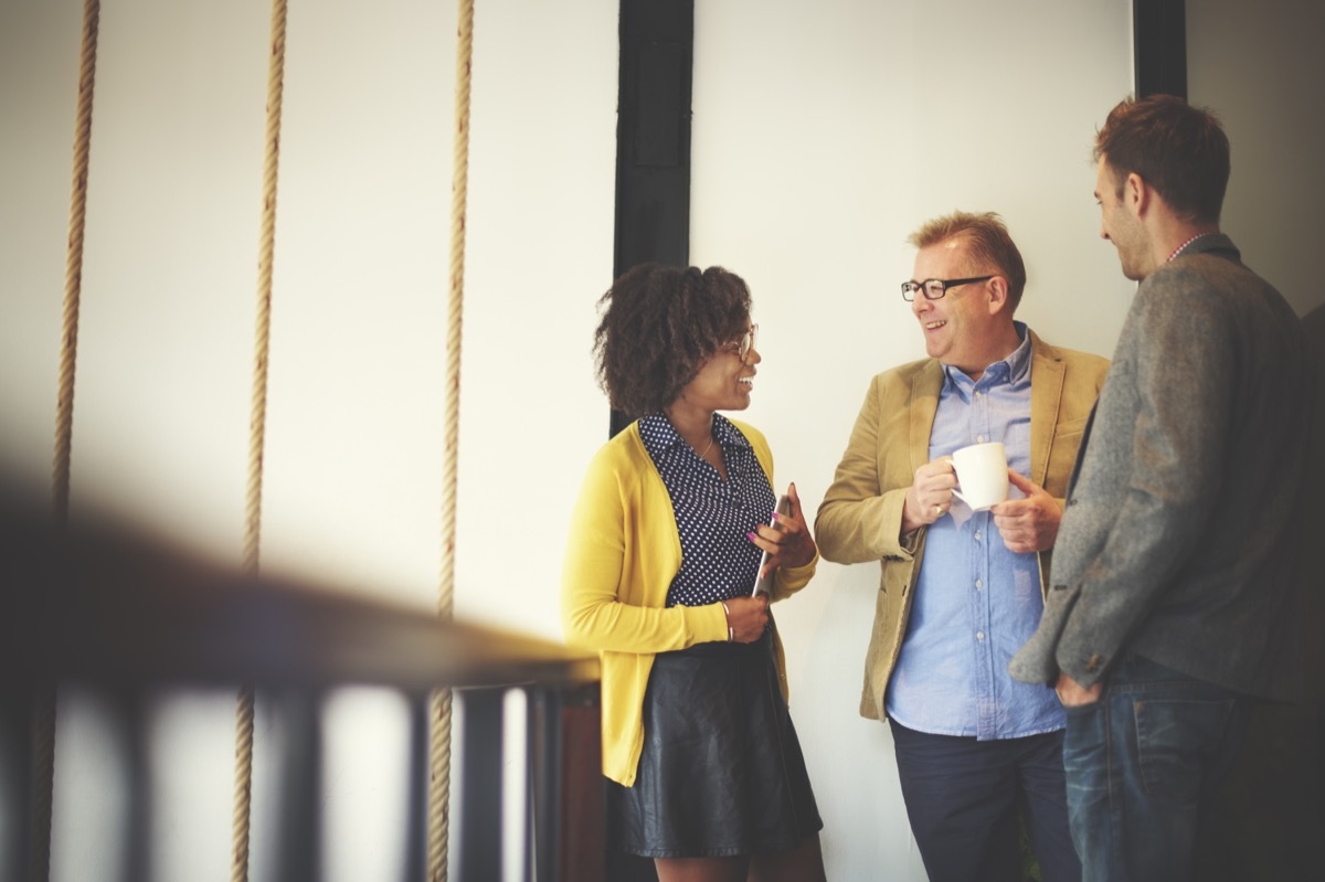 coworkers chatting during an office coffee break