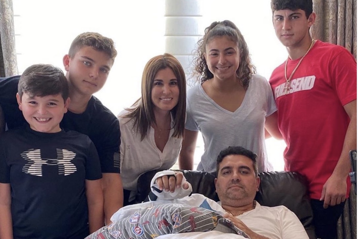 Buddy Valastro surrounded by his family after hand injury