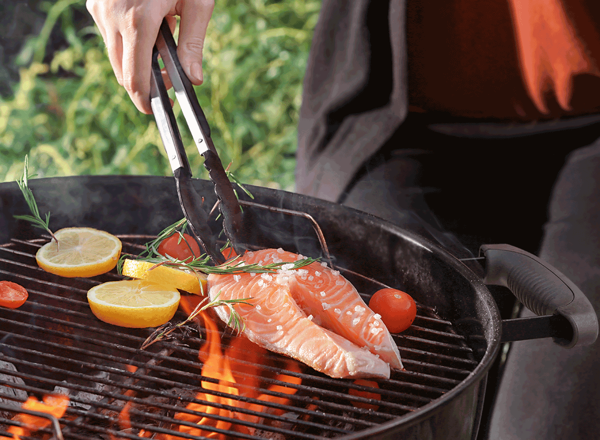 tongs grilling salmon