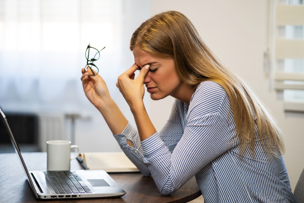 Woman itching her eyes