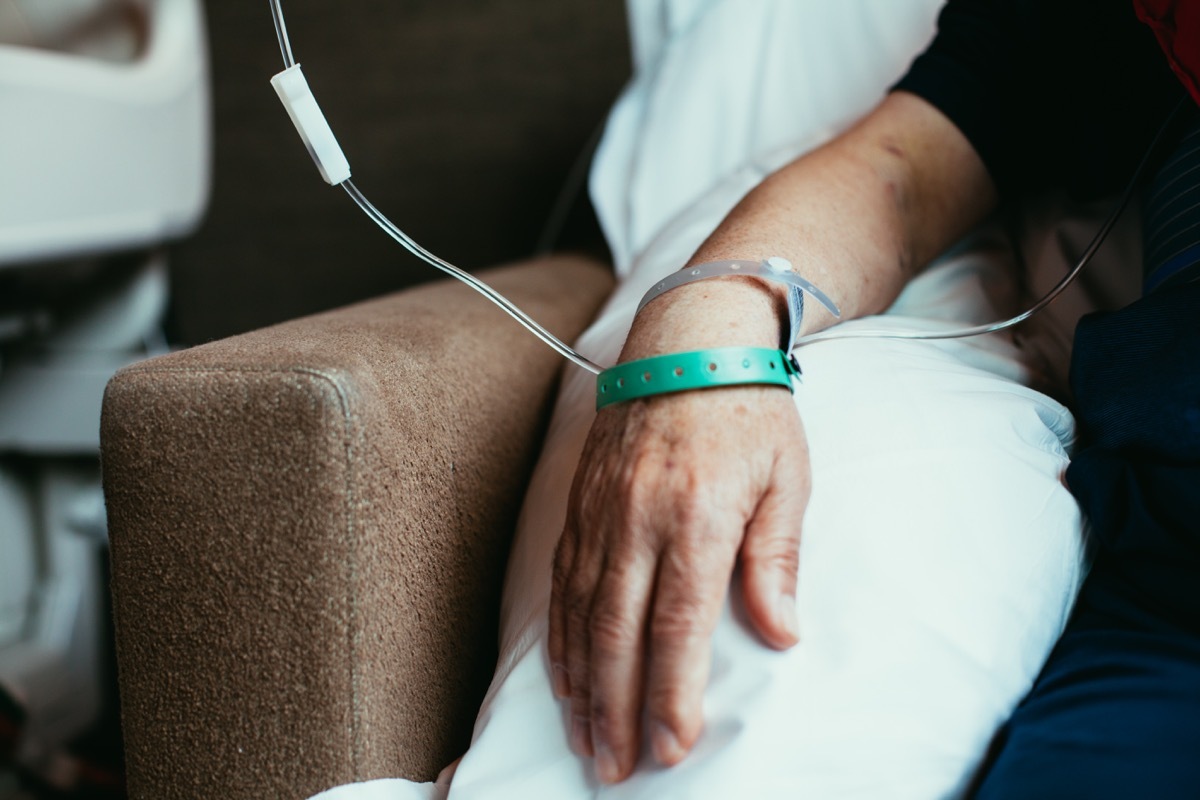 Old man patient hand in hospital