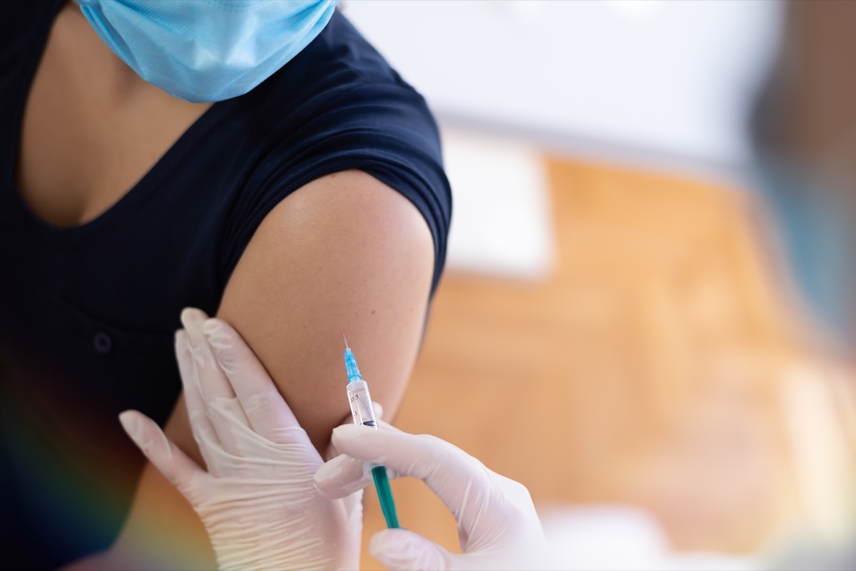 Woman getting COVID vaccine