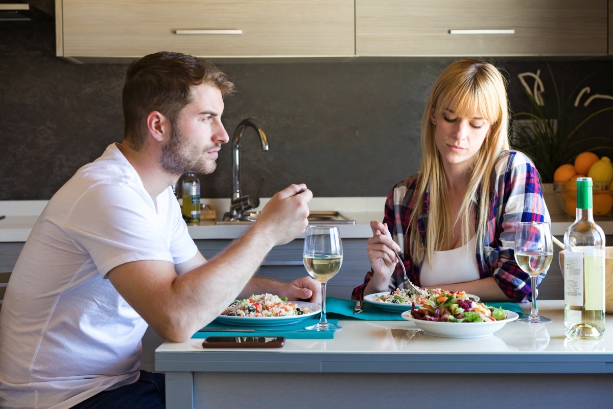 Sad couple eating together. 