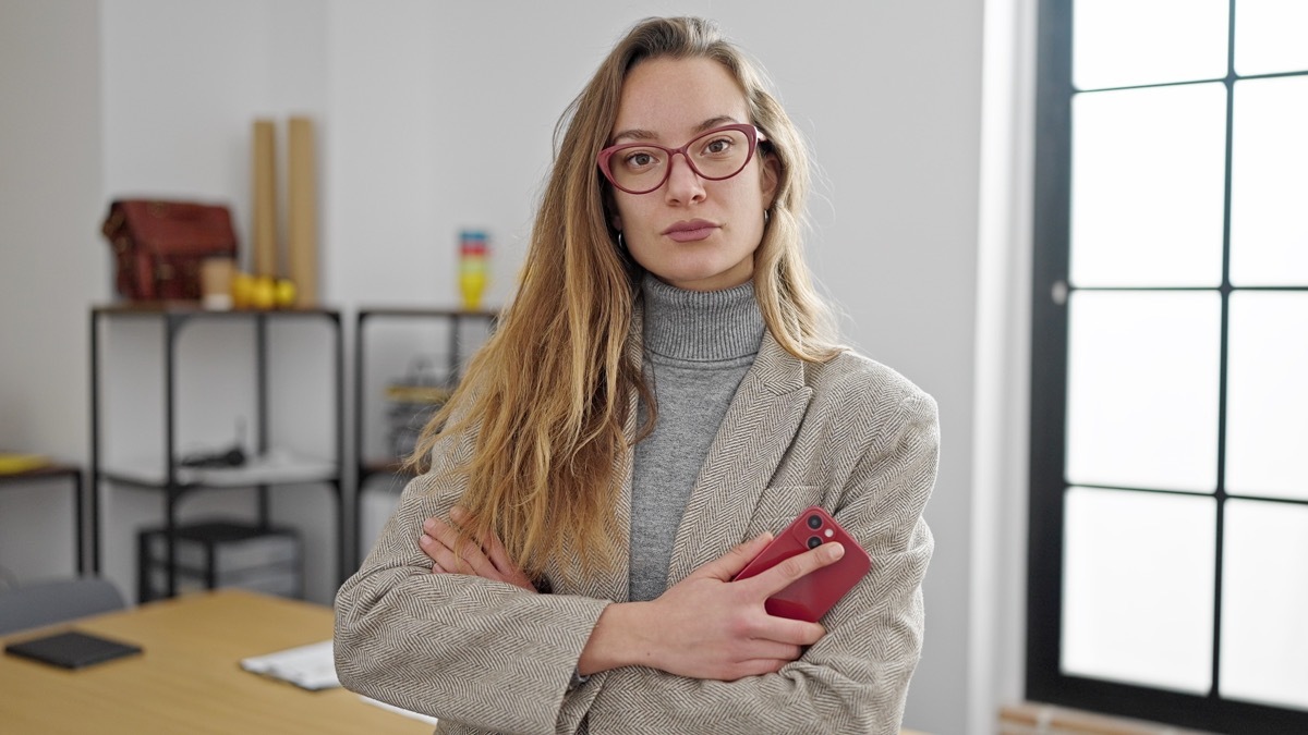 Serious Woman with Crossed Arms