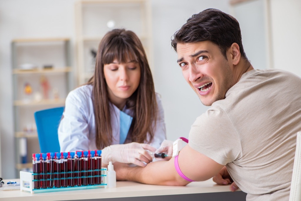 Man is scared of blood and needles at the doctor's office.