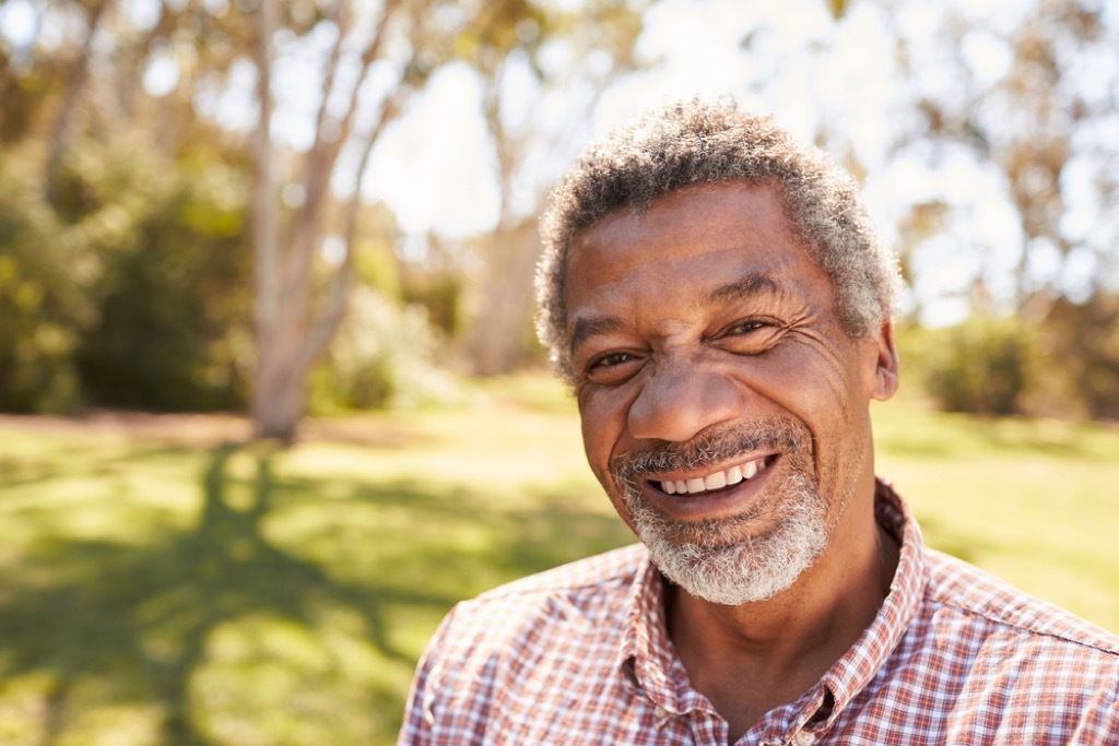 man with gray hair outdoors