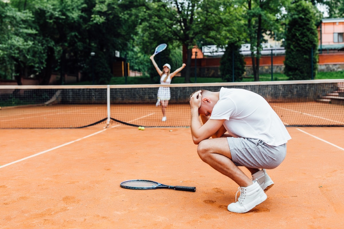 Man Losing Game of Tennis