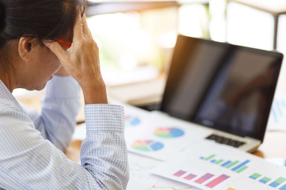 woman tired at work desk