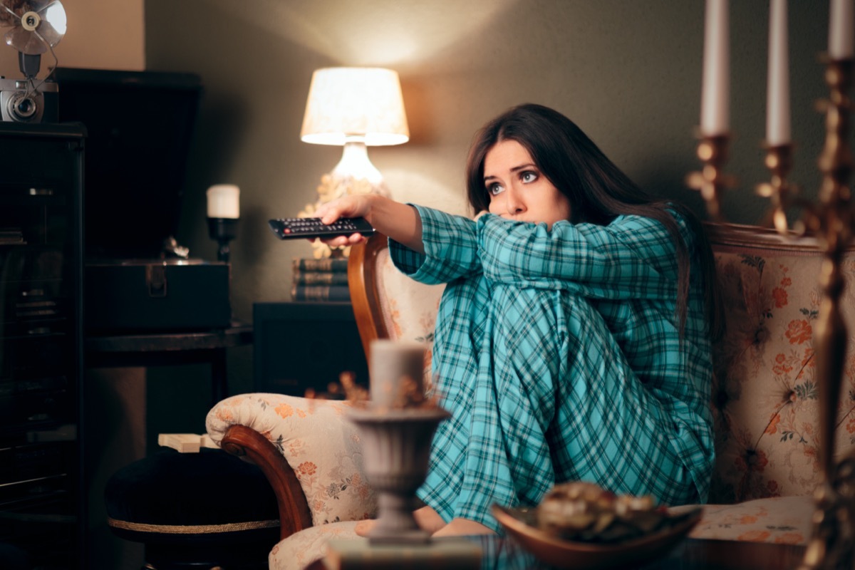 Woman Wearing Pajamas Watching TV in her Room