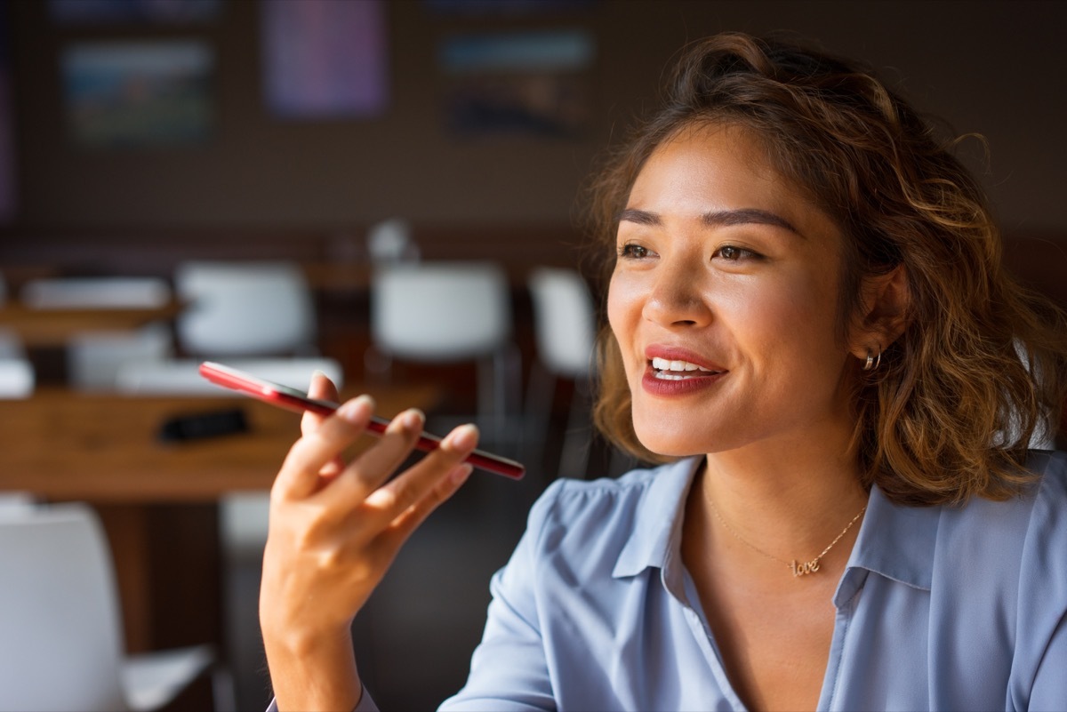 Woman Talking on Phone with Loudspeaker