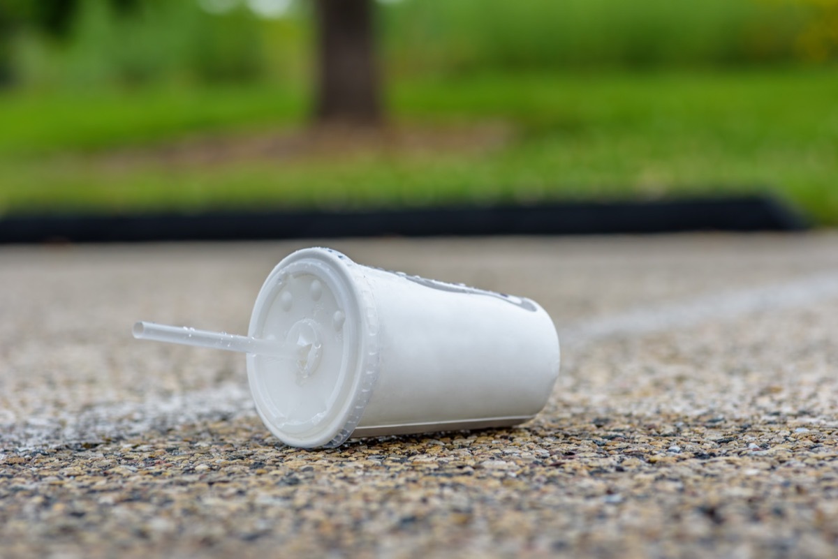 soda to-go cup on the ground, objects using wrong