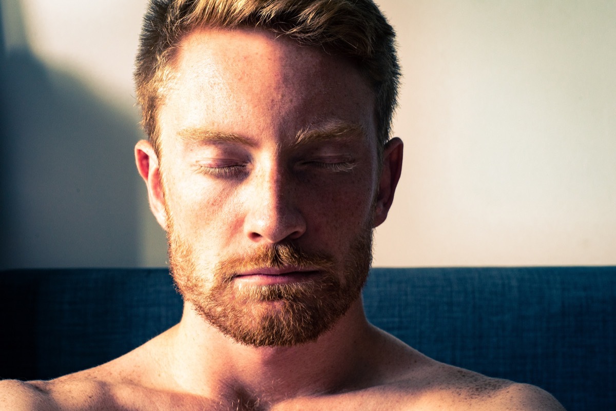 Eyelids Closed on man with red hair