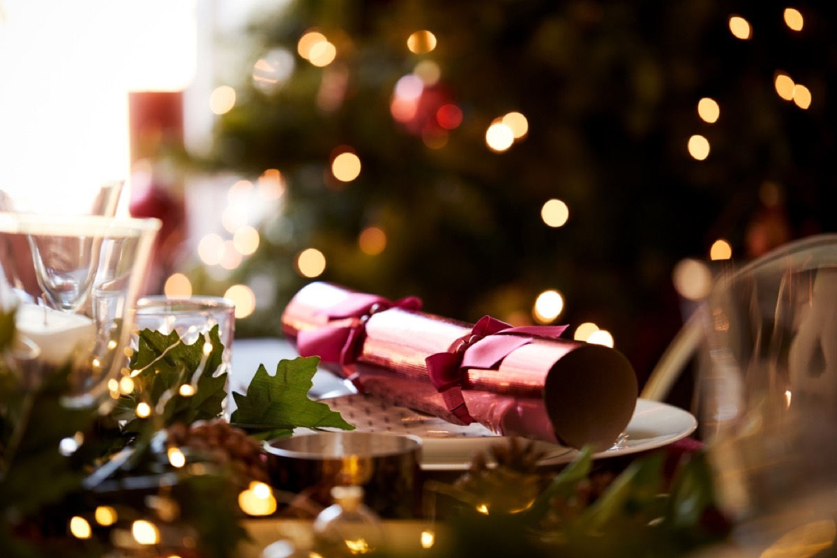 Red christmas cracker on table