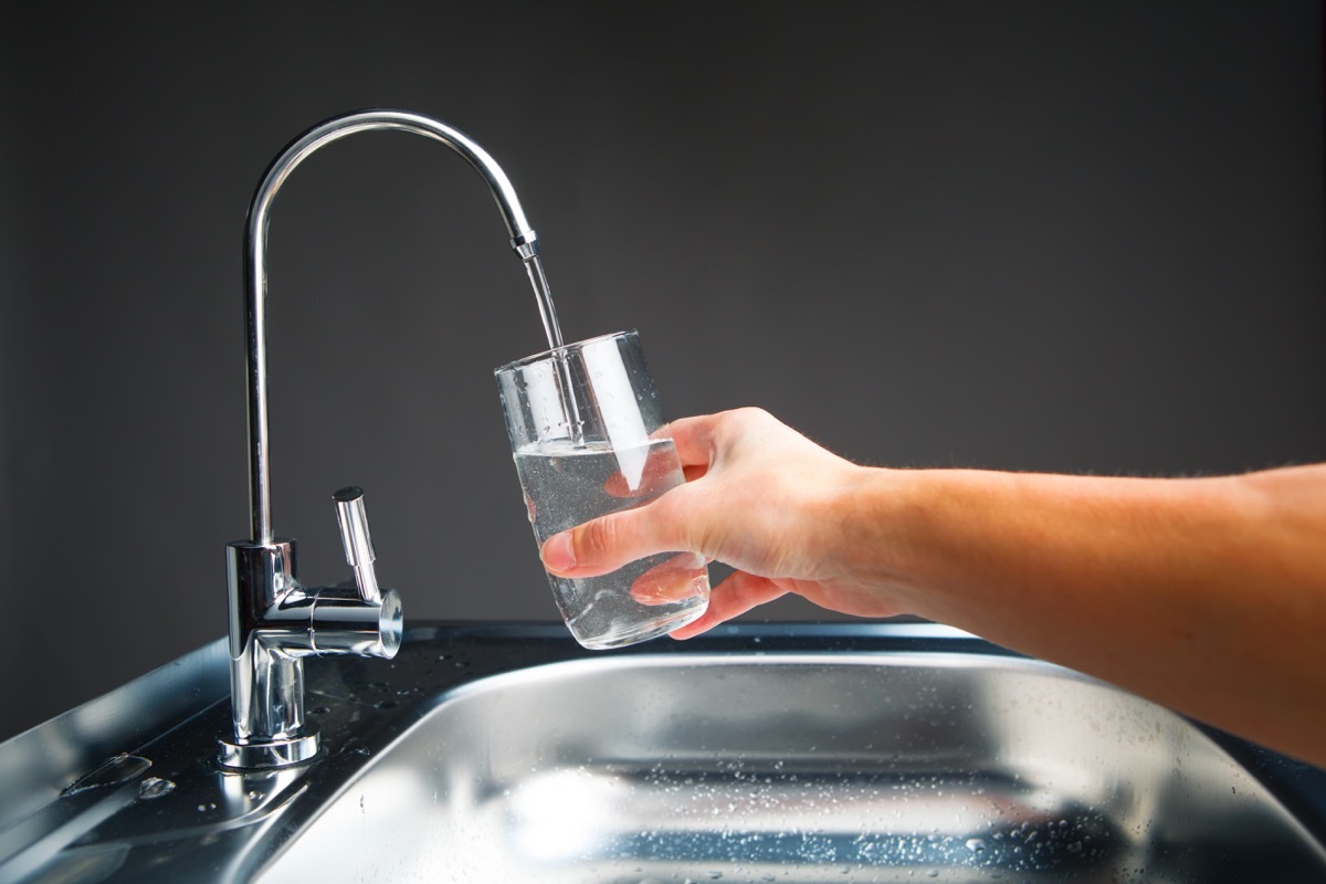 hand pouring water filtered out of a fauct, NASA everyday items